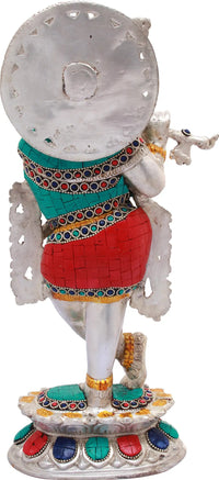 Back view of handmade brass Shri Krishna statue, jeweled belt and red/green skirt