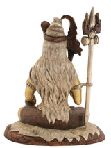 Back view of seated Lord Shiva brass sculpture with long hair and trident staff
