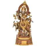 Handcrafted brass sculpture of Venugopala holding flute, ornate gold and silver details