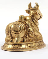 Brass carved Nandi statue base with detailed figures of Shiva and Parvati