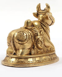Brass carved Nandi statue base with detailed figures of Shiva and Parvati