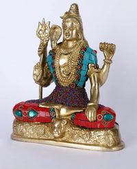 Handmade brass Shiva statue, raised hands in Ashirwad mudra, teal pendant, beaded red base