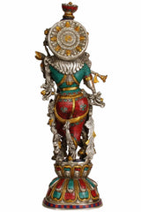 Brass Krishna statue back view with flute, decorative halo plate, blue and red garments