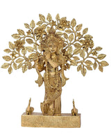 Brass Krishna idol playing flute, ornate floral tree design, on rectangular pedestal