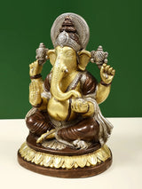 Brass Lord Ganpathi 8-inch idol, seated Ganesha with detailed crown and four arms.
