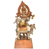 Venugopala brass sculpture riding a horse, crown headdress, gold accents and silver tone