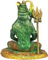 Back view of seated Shiva brass idol in green with trident and detailed textured base