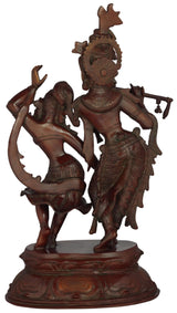 Radha-Krishna brass dance statue, close view of carved faces, dark bronze finish