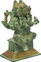 Brass two-headed Ganesha statue with green patina, four arms raised, engraved pedestal