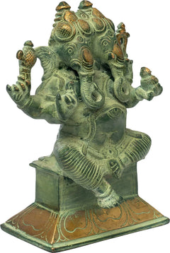 Brass two-headed Ganesha statue with green patina, four arms raised, engraved pedestal