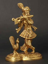 Lord Krishna playing flute figurine with peacock detail, standing on ornate base, gold