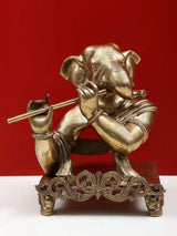 AONA brass Ganesha flute statue, 11 inch—profile view, detailed jewelry and flowing base