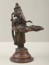 Brass Lord Ganesha twin lamp figurine, curved arms supporting two flame dishes