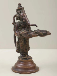 Brass Lord Ganesha twin lamp figurine, curved arms supporting two flame dishes