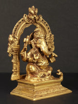 Brass Ganesha Maharaj statue three-quarter view with ornate arch frame