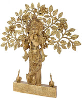 Krishna brass figurine playing flute, raised relief floral branches, mounted on pedestal