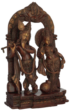 Brass Radha-Krishna double chala sculpture, Radha at right holding pot; Krishna left
