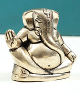 Handmade brass Ganesha good-luck statue, small 2 in, side view with trunk detail