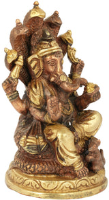 Ganesha brass sculpture on Shesha Naga base, seated, brown and gold tones