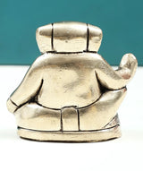 Handmade brass Ganesha good-luck statue, small 2 in, back view with tail and skirt