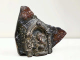 Rock sculpture with framed Ganesha temple relief and antique brass details