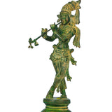 Green chala brass Krishna statue playing flute, raised arms, decorative armor design