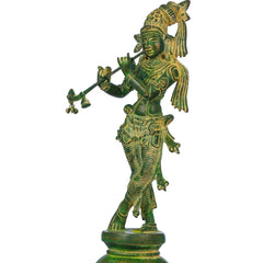 Green chala brass Krishna statue playing flute, raised arms, decorative armor design