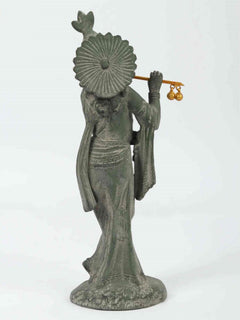 Handcrafted green patina brass Krishna flute statue, back view, fan-like halo, golden ornaments