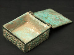Antique green brass Ganesha box, open lid showing empty interior tray