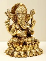 Brass Lord Ganesha seated, front view with ornate halo and raised hands