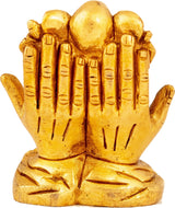 Brass Ganesha figurine showing back of raised hands, 2 inches