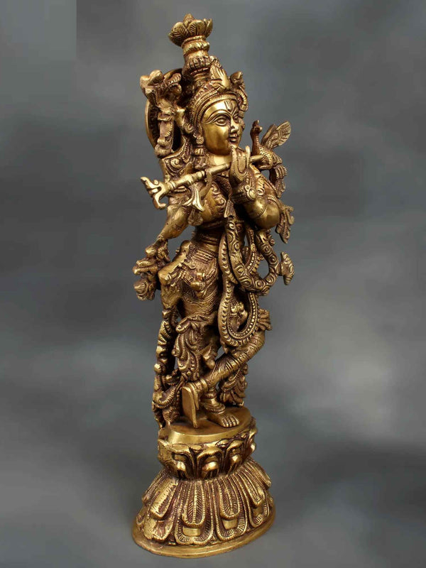 Brass statue depicting Lord Krishna playing the flute 18 inches Entryway Setting
