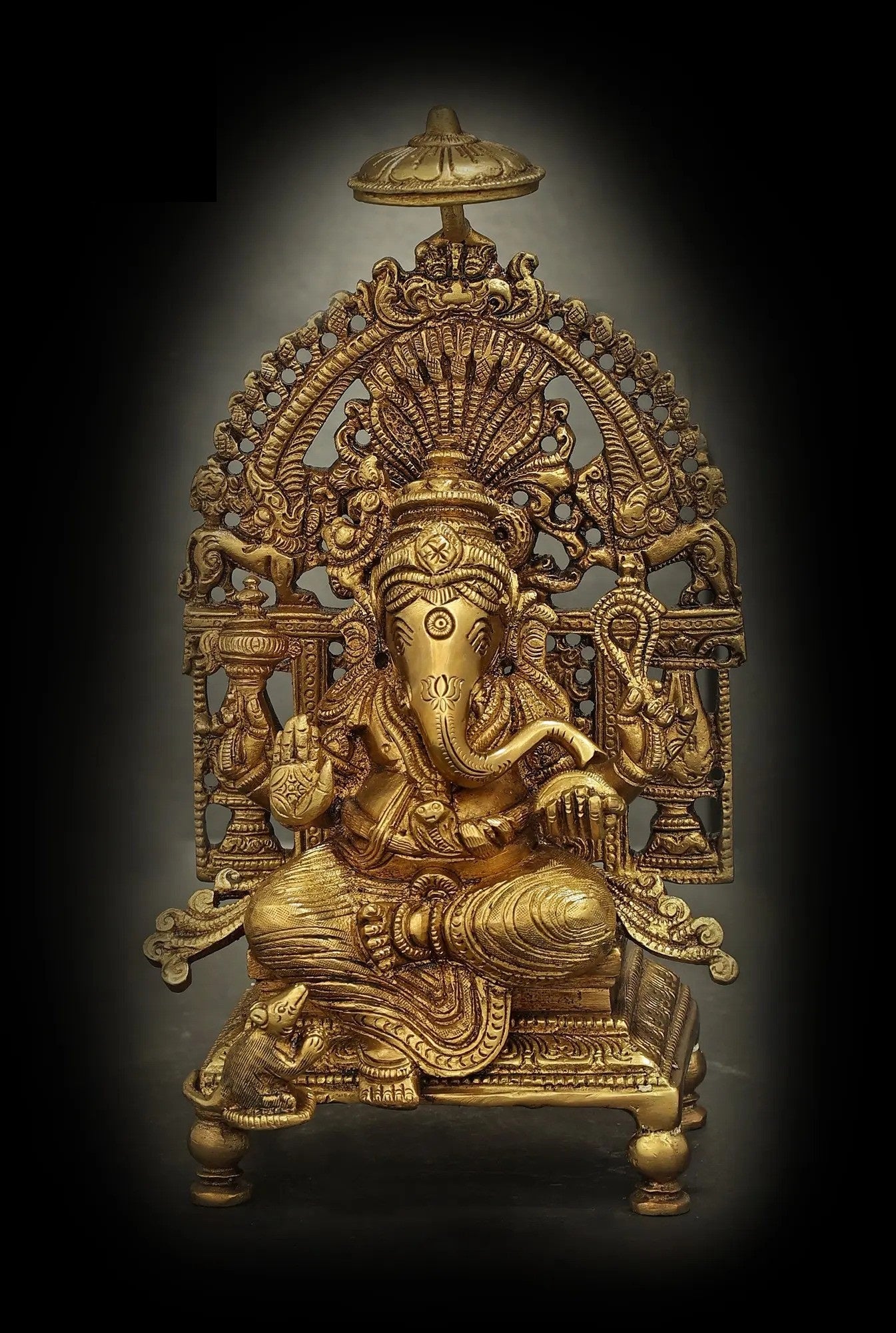 Brass Lord Ganesha Seated on a Majestic Throne, Radiating Auspiciousness 5 Inches