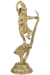 Natural brass Krishna statue facing left, one arm extended on serpent tail base