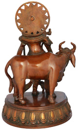Brass Krishna statue with cow (rear view), round halo and decorative base, 10 inch