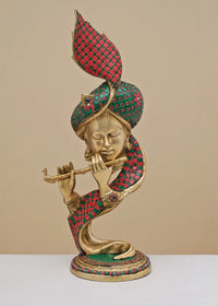 Handmade brass modern Krishna sculpture with red patterned inlay, playing flute