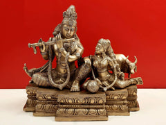 Handcrafted brass Krishna with Radha figure and cow, front view on base