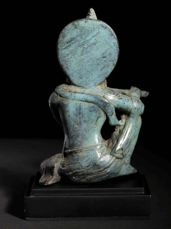 Small Brass Idol of Murli Manohar Krishna Seated on a Wooden Base 6 Inches Study Setting