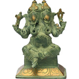5-inch brass two-headed Ganesha sculpture with four arms and ornate relief detailing