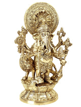 Brass Ganesha statue with lion mount, multiple arms holding weapons and halo