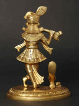 Lord Krishna flute statue, side view, gold tone, decorative base with etched pattern