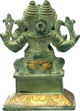 Brass two-headed Ganesha figurine, front view, textured detailing and green patina finish