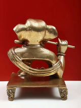 Back view of brass Ganesha playing flute statue, 11 inch—carved details on pedestal