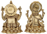Back view brass Lakshmi and Ganesha figurines, circular halos and carved detailing