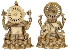 Back view brass Lakshmi and Ganesha figurines, circular halos and carved detailing