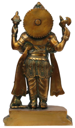 Brass Ganesha statue from behind, detailed crown and raised arm ornaments