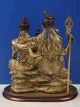 Brass Shiva-Parvati-Ganesha statue, rear side view with raised trident staff