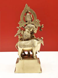 Natural brass Venugopala sculpture on horse/cow with flared halo back, ornate details