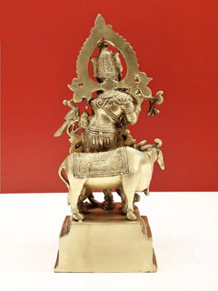 Natural brass Venugopala sculpture on horse/cow with flared halo back, ornate details