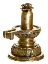 Natural brass Shivalinga idol with flower offerings on ornate pedestal base